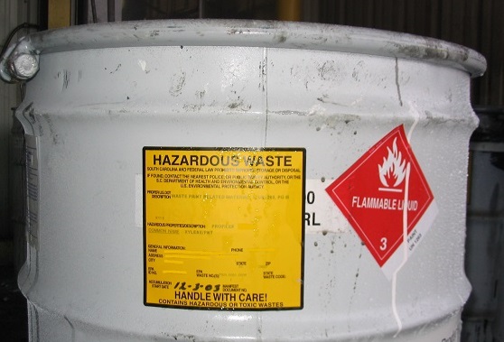 (labeled chemical waste drum)